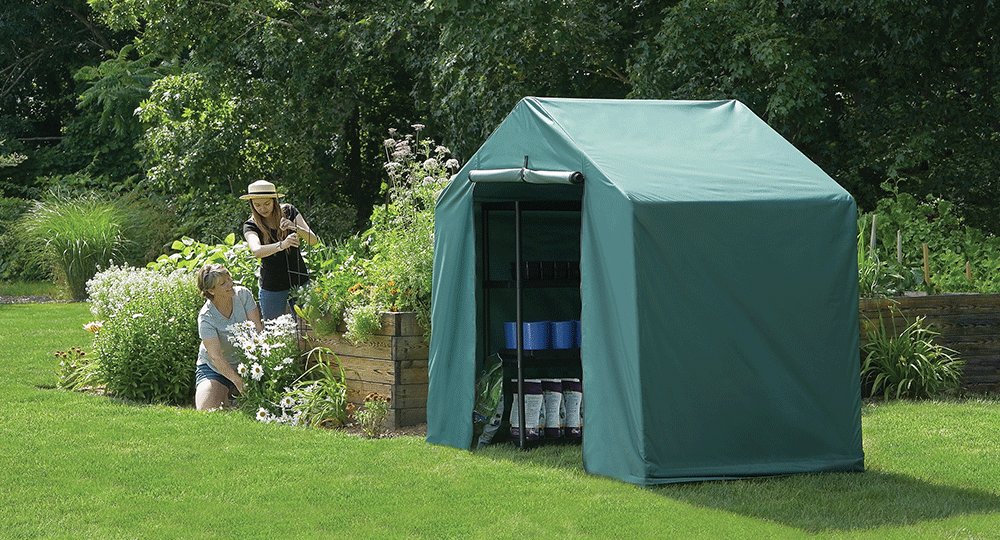 2 women gardening next to a garden shed