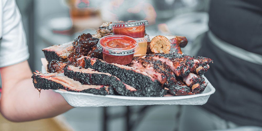 A platter full of smoked meats from a meat smoker