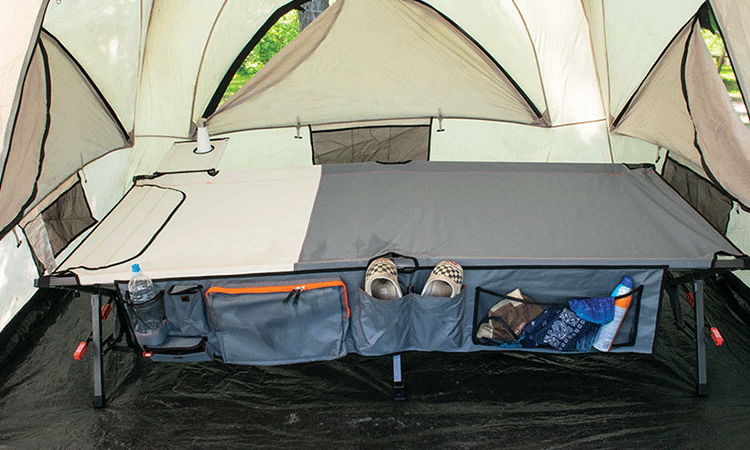 A cot inside a camping tent